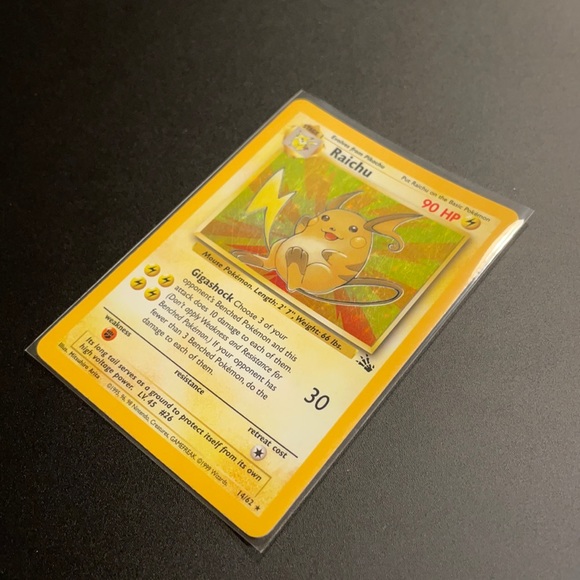 Pokémon Raichu fossil holographic card.